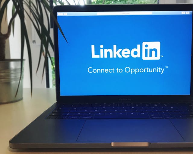 A laptop screen displaying the LinkedIn homepage, emphasizing professional networking opportunities.